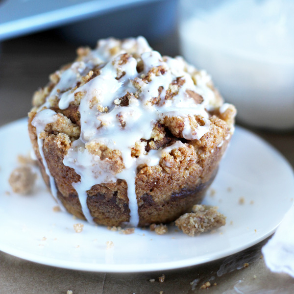 Pumpkin Streusel Muffins - These muffins are topped with a crunchy streusel and sweet vanilla glaze. Perfect for that cool fall morning breakfast or dessert that is sure to win over the hearts of many. NeuroticMommy.com #vegan #thanksgiving #breakfast