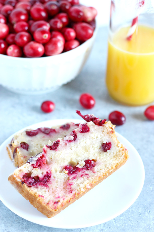 Vegan Cranberry Orange Loaf Cake - Luscious cranberry loaf cake drizzled with a sweet orange glaze. The perfect addition to holiday festivities. NeuroticMommy.com #vegan #thanksgiving