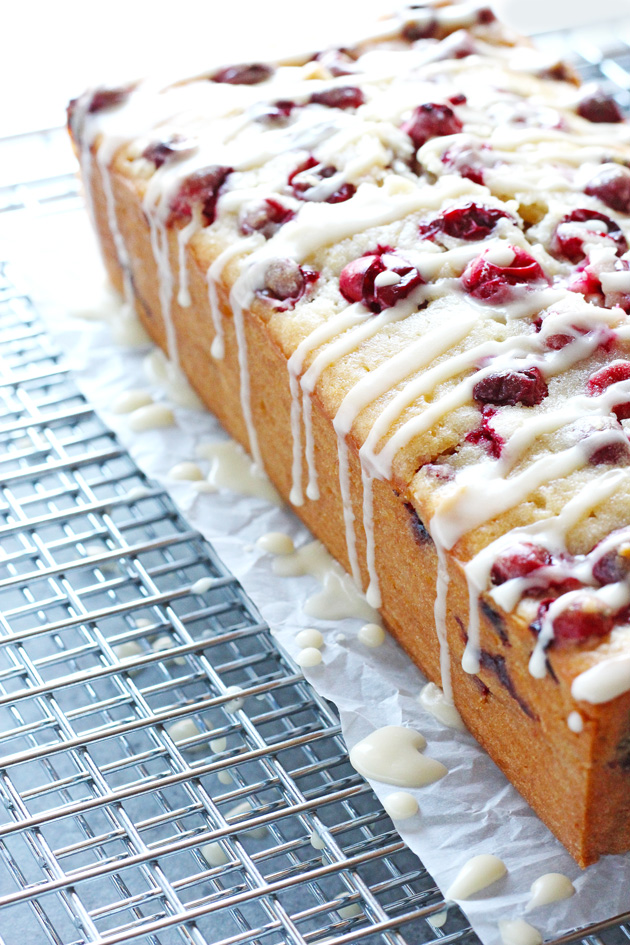 Vegan Cranberry Orange Loaf Cake - Luscious cranberry loaf cake drizzled with a sweet orange glaze. The perfect addition to holiday festivities. NeuroticMommy.com #vegan #thanksgiving