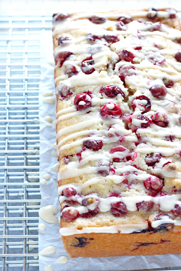 Vegan Cranberry Orange Loaf Cake - Luscious cranberry loaf cake drizzled with a sweet orange glaze. The perfect addition to holiday festivities. NeuroticMommy.com #vegan #thanksgiving