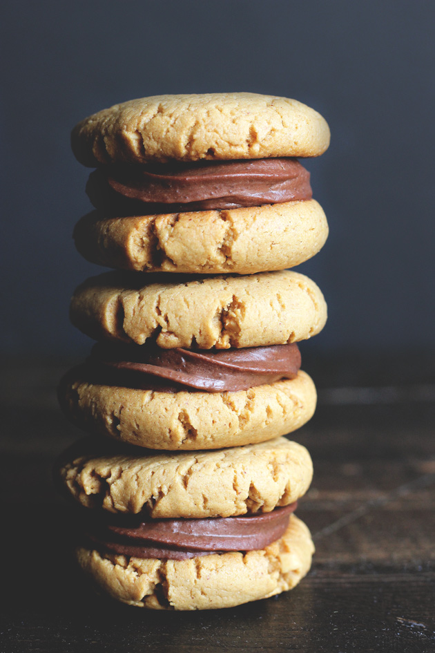 Chocolate Peanut Butter Sandwich Cookies filled with a sexy creamy chocolate and surrounded by soft, chewy, peanutty cookies. NeuroticMommy.com #vegan #healthy #cookies