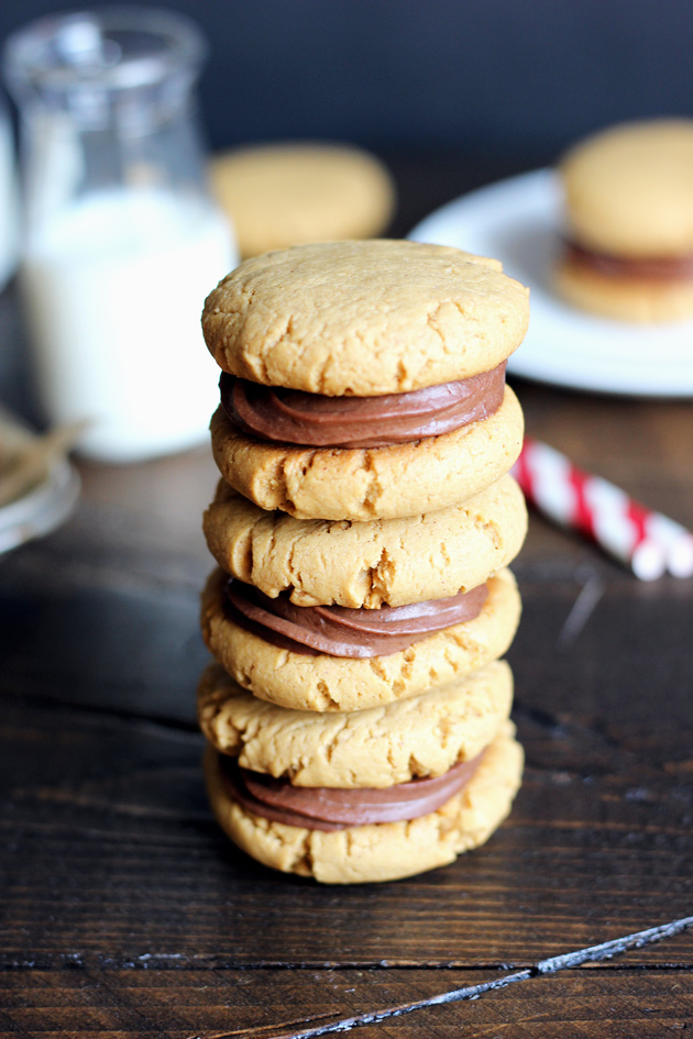 Chocolate Peanut Butter Sandwich Cookies filled with a sexy creamy chocolate and surrounded by soft, chewy, peanutty cookies. NeuroticMommy.com #vegan #healthy #cookies