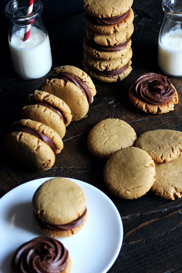 Chocolate Peanut Butter Sandwich Cookies filled with a sexy creamy chocolate and surrounded by soft, chewy, peanutty cookies. NeuroticMommy.com #vegan #healthy #cookies