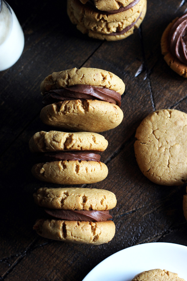 Chocolate Peanut Butter Sandwich Cookies filled with a sexy creamy chocolate and surrounded by soft, chewy, peanutty cookies. NeuroticMommy.com #vegan #healthy #cookies