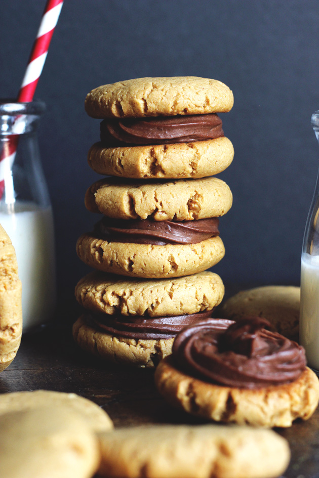 Chocolate Peanut Butter Sandwich Cookies filled with a sexy creamy chocolate and surrounded by soft, chewy, peanutty cookies. NeuroticMommy.com #vegan #healthy #cookies