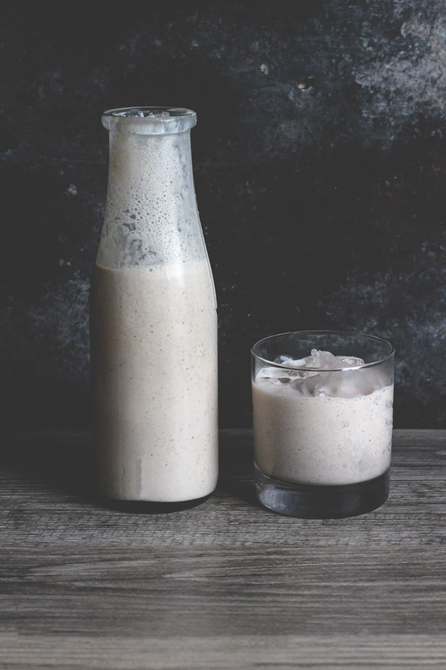 Vegan Coquito - A traditional sweet Puerto Rican Egg Nog-like alcoholic beverage that is served every Christmas. Enjoy this thick and creamy vegan version that tastes just like the real thing! NeuroticMommy.com #vegan #beverages 