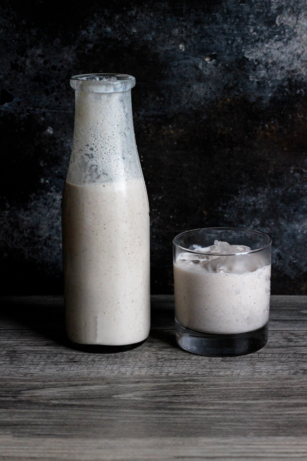 Vegan Coquito - A traditional sweet Puerto Rican Egg Nog-like alcoholic beverage that is served every Christmas. Enjoy this thick and creamy vegan version that tastes just like the real thing! NeuroticMommy.com #vegan #beverages