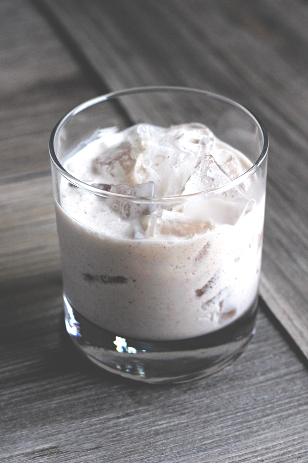 Vegan Coquito - A traditional sweet Puerto Rican Egg Nog-like alcoholic beverage that is served every Christmas. Enjoy this thick and creamy vegan version that tastes just like the real thing! NeuroticMommy.com #vegan #beverages 