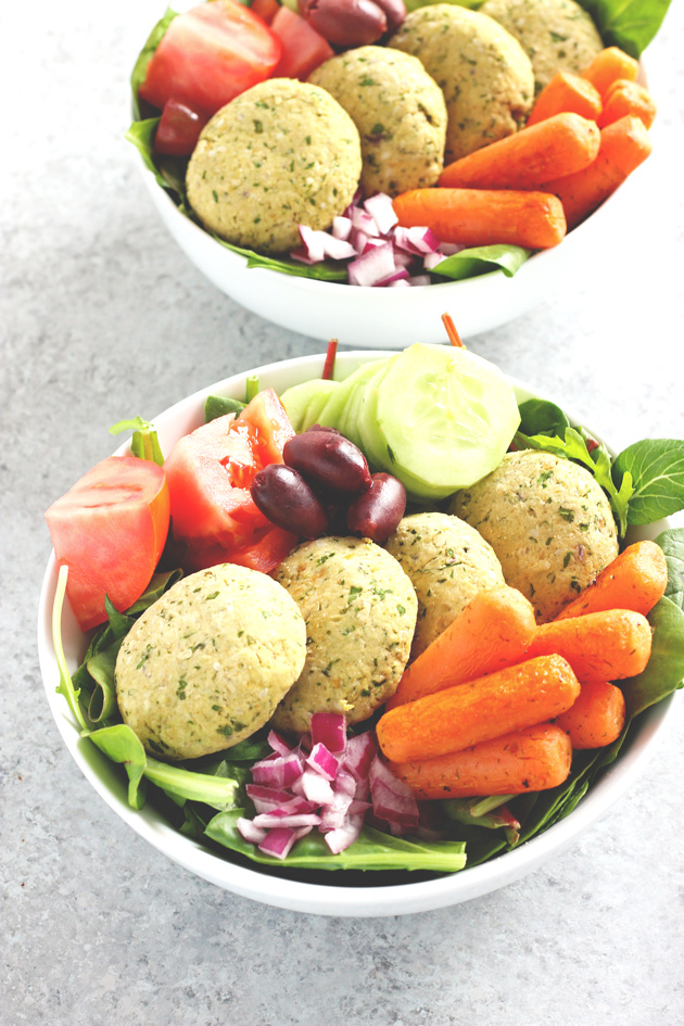 Mediterranean Infused Bliss Bowls - Delectable bowls loaded with falafel, leafy greens, roasted carrots, red onion, tomato, kalamata olives, and cucumbers. Perfectly filling, perfectly healthy. NeuroticMommy.com #vegan #healthy