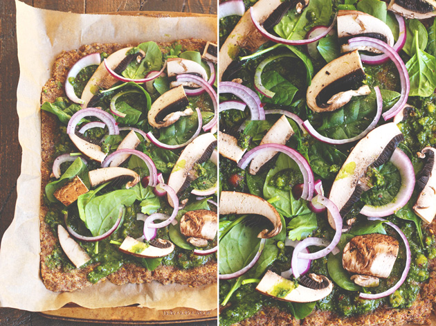 This pizza will hit the spot, it's satisfying, with the right amount of pesto and flavor. Jam packed with nutrients and one of many meals to share with the family after holidays full of sweets. NeuroticMommy.com #vegan #raw #healthy #pizza