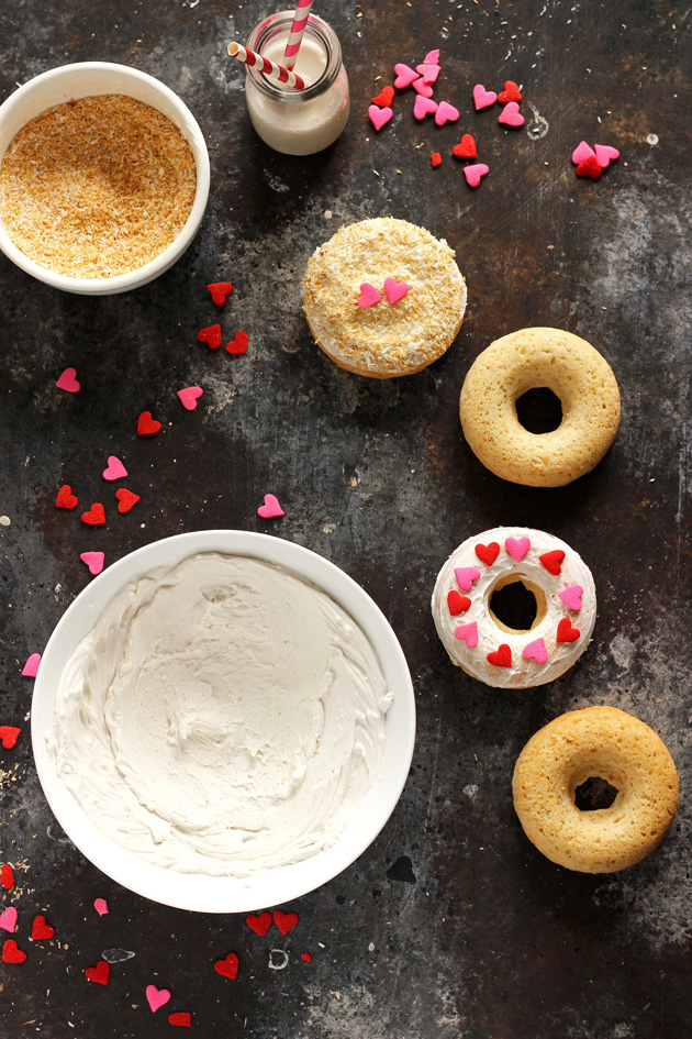 Valentine's Day Toasted Coconut Doughnuts - Fluffy cream filled doughnuts topped with toasted coconut shreds and loving hearts. Perfect for Valentine's Day! NeuroticMommy.com #vegan #donuts #valentinesday