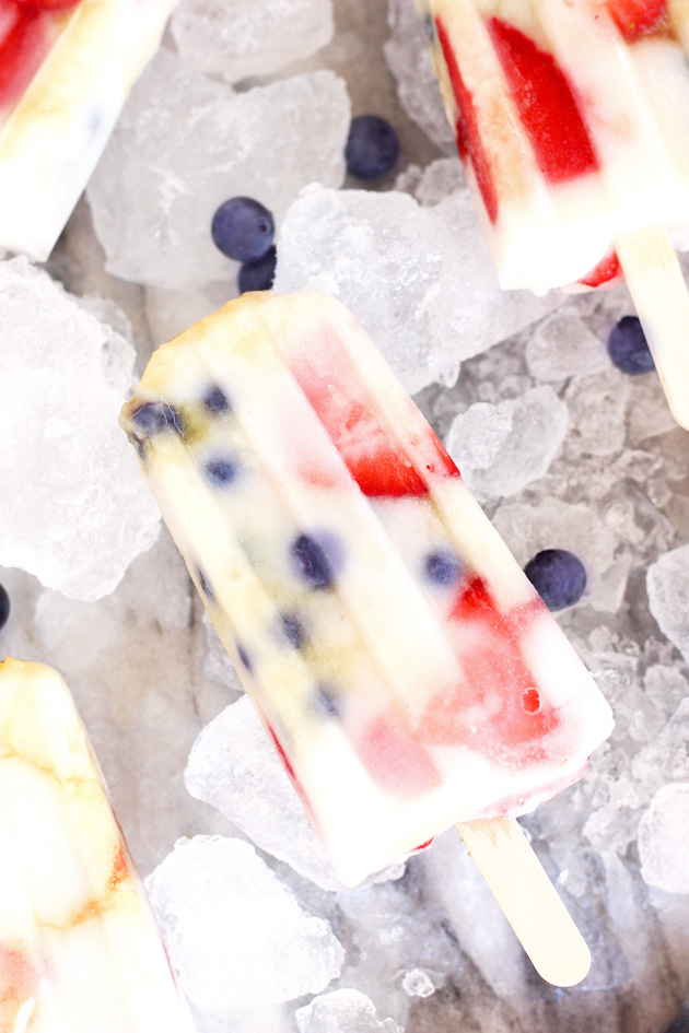 Fruit Fun Yogurt Ice Pops - Cool down with these fresh strawberry blueberry creamy yogurt ice pops that your whole family will LOVE! They're the perfect dairy-free frozen treat on the hottest of summer days. NeuroticMommy.com #healthy #vegan #summer #snacks