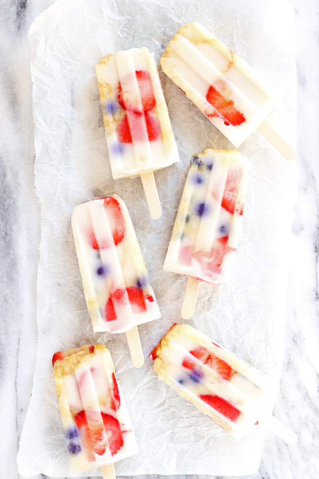 Fruit Fun Yogurt Ice Pops - Cool down with these fresh strawberry blueberry creamy yogurt ice pops that your whole family will LOVE! They're the perfect dairy-free frozen treat on the hottest of summer days. NeuroticMommy.com #healthy #vegan #summer #snacks