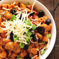 One Pot Vegan Enchilada Pasta - This go to weeknight dinner is perfect for healthy, quick, and easy. The melty vegan cheese, vegetables, and comfort of pasta are ready to eat in less than 20 minutes. NeuroticMommy.com #vegan #dinner #backtoschool