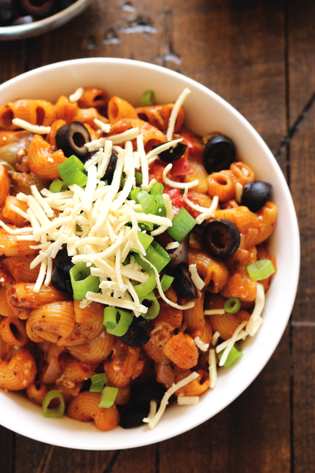 One Pot Vegan Enchilada Pasta - This go to weeknight dinner is perfect for healthy, quick, and easy. The melty vegan cheese, vegetables, and comfort of pasta are ready to eat in less than 20 minutes. NeuroticMommy.com #vegan #dinner #backtoschool