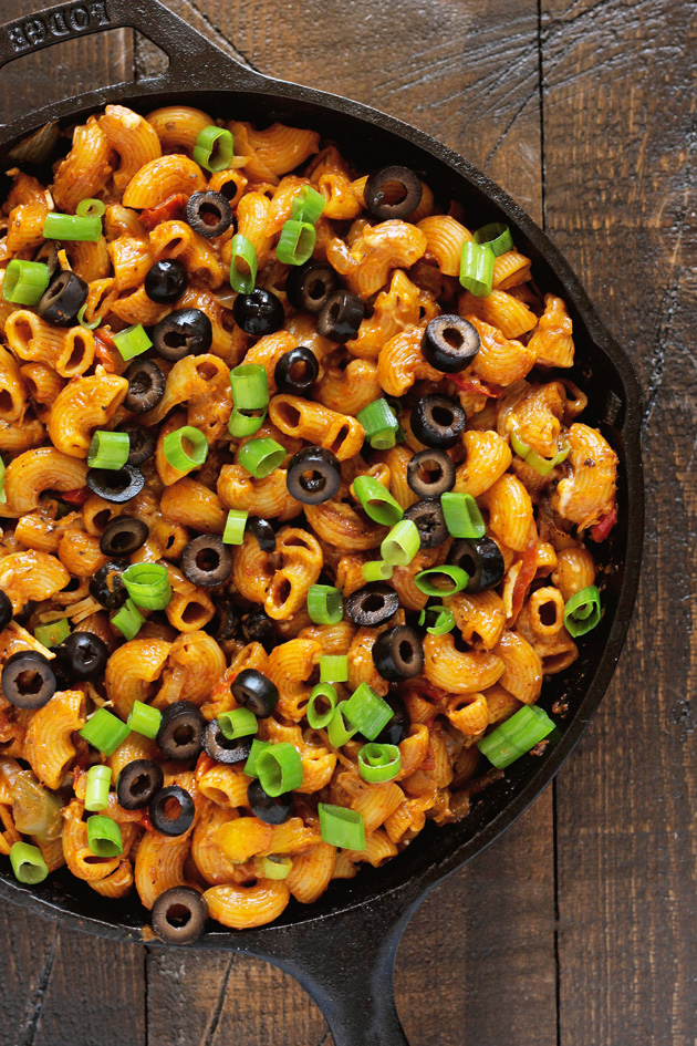 One Pot Vegan Enchilada Pasta - This go to weeknight dinner is perfect for healthy, quick, and easy. The melty vegan cheese, vegetables, and comfort of pasta are ready to eat in less than 20 minutes. NeuroticMommy.com #vegan #dinner #backtoschool