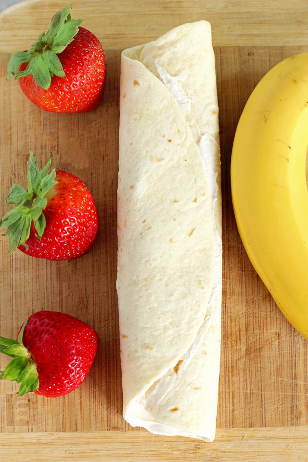 Stuffed Tortilla Cheesecake French Toast - This is the best breakfast, dessert, snack, ever! Stuffed with healthy dark chocolate, strawberries, bananas, and vegan cream cheese, you legit can't go wrong. NeuroticMommy.com #vegan #brunch #healthy