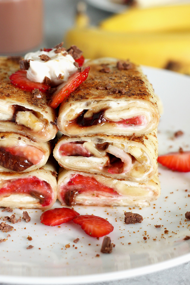 Stuffed Tortilla Cheesecake French Toast - This is the best breakfast, dessert, snack, ever! Stuffed with healthy dark chocolate, strawberries, bananas, and vegan cream cheese, you legit can't go wrong. NeuroticMommy.com #vegan #brunch #healthy