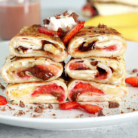 Stuffed Tortilla Cheesecake French Toast - This is the best breakfast, dessert, snack, ever! Stuffed with healthy dark chocolate, strawberries, bananas, and vegan cream cheese, you legit can't go wrong. NeuroticMommy.com #vegan #brunch #healthy