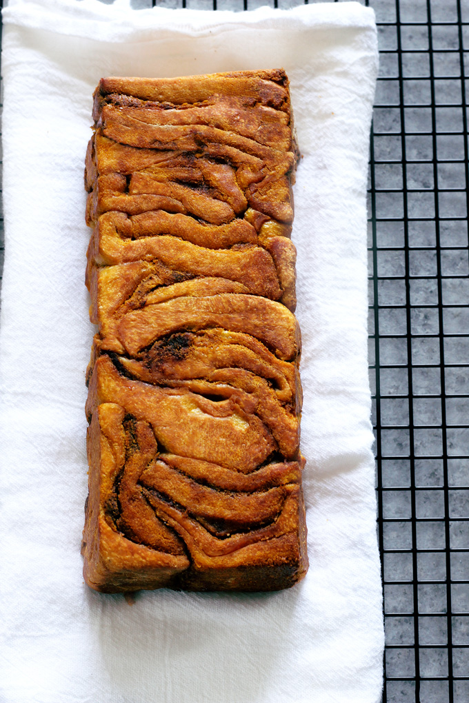 Pumpkin Pull Apart Bread - the perfect comforting snack to kick off fall season with. Drizzled with pumpkin spice icing, you cannot go wrong! NeuroticMommy.com #vegan #fall #breads