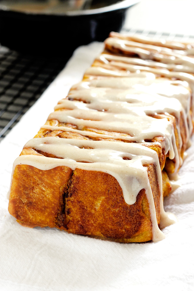 Pumpkin Pull Apart Bread - the perfect comforting snack to kick off fall season with. Drizzled with pumpkin spice icing, you cannot go wrong! NeuroticMommy.com #vegan #fall #breads