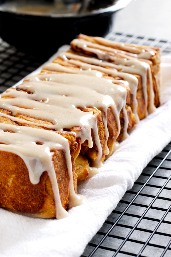 Pumpkin Pull Apart Bread - the perfect comforting snack to kick off fall season with. Drizzled with pumpkin spice icing, you cannot go wrong! NeuroticMommy.com #vegan #fall #breads