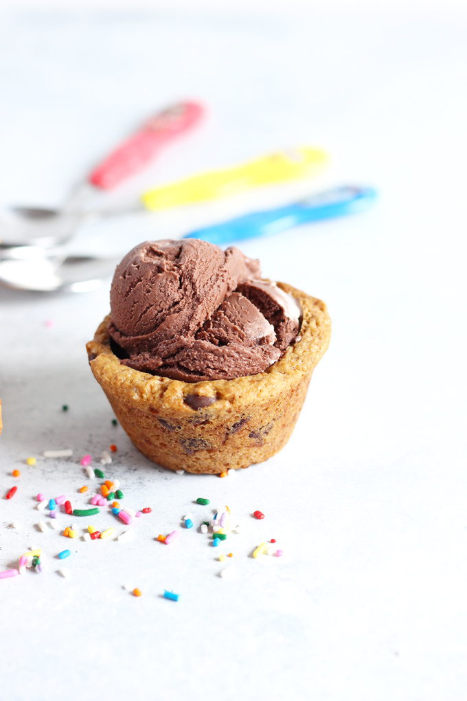 Chocolate Chip Cookie Cup Sundae - Have fun and get romantic with these chocolate chip cookie cups. Topped with #vegan ice cream and chocolate sauce...you don't want to miss out. Super easy to make! NeuroticMommy.com #desserts #valentinesday