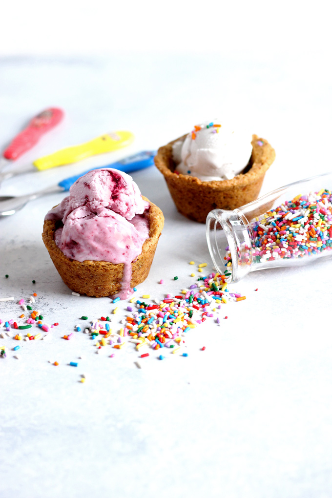 Chocolate Chip Cookie Cup Sundae - Have fun and get romantic with these chocolate chip cookie cups. Topped with #vegan ice cream and chocolate sauce...you don't want to miss out. Super easy to make! NeuroticMommy.com #desserts #valentinesday