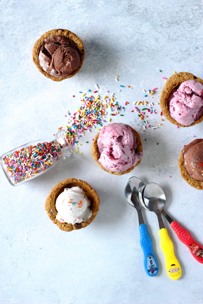 Chocolate Chip Cookie Cup Sundae - Have fun and get romantic with these chocolate chip cookie cups. Topped with #vegan ice cream and chocolate sauce...you don't want to miss out. Super easy to make! NeuroticMommy.com #desserts #valentinesday