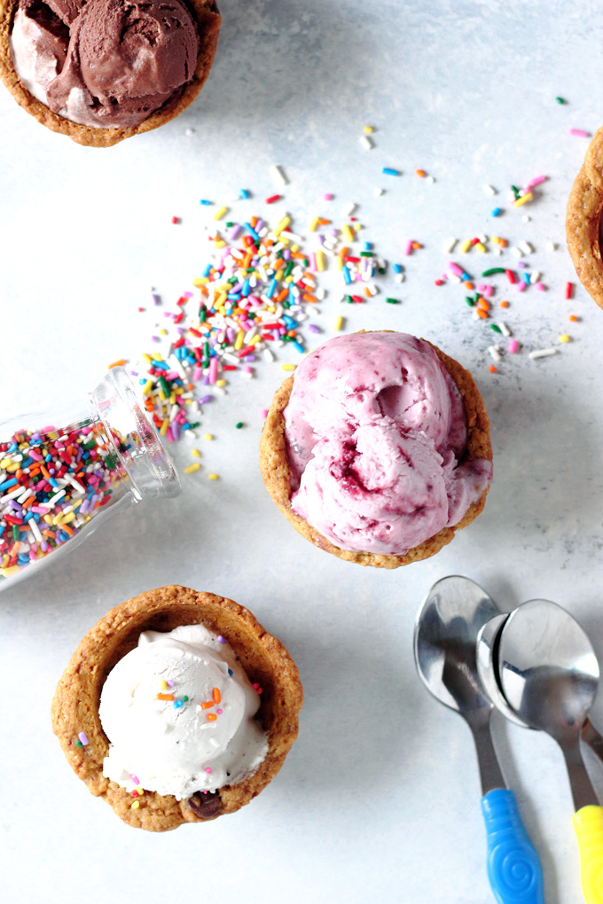 Chocolate Chip Cookie Cup Sundae - Have fun and get romantic with these chocolate chip cookie cups. Topped with #vegan ice cream and chocolate sauce...you don't want to miss out. Super easy to make! NeuroticMommy.com #desserts #valentinesday 