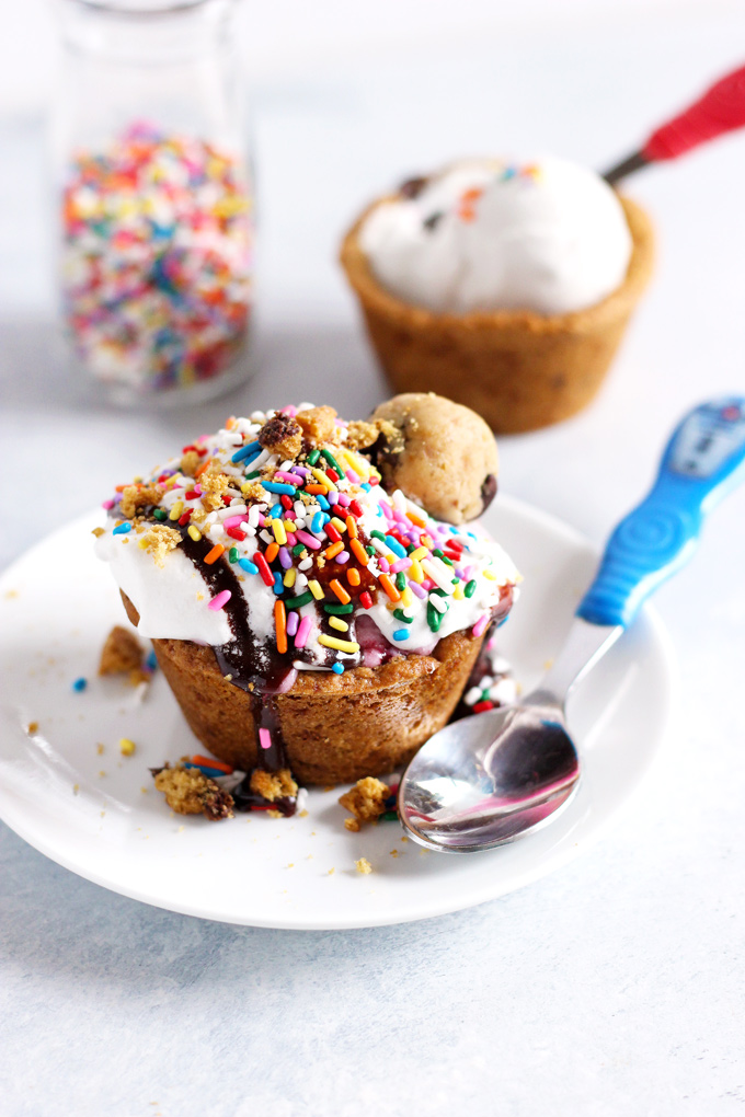 Chocolate Chip Cookie Cup Sundae - Have fun and get romantic with these chocolate chip cookie cups. Topped with #vegan ice cream and chocolate sauce...you don't want to miss out. Super easy to make! NeuroticMommy.com #desserts #valentinesday 