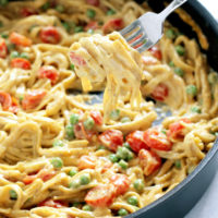 One Pot Vegan Fettuccine Alfredo with Peas and Roasted Cherry Tomatoes - Creamy healthy deliciousness all in one pot. NeuroticMommy.com #vegan #dinner #healthy