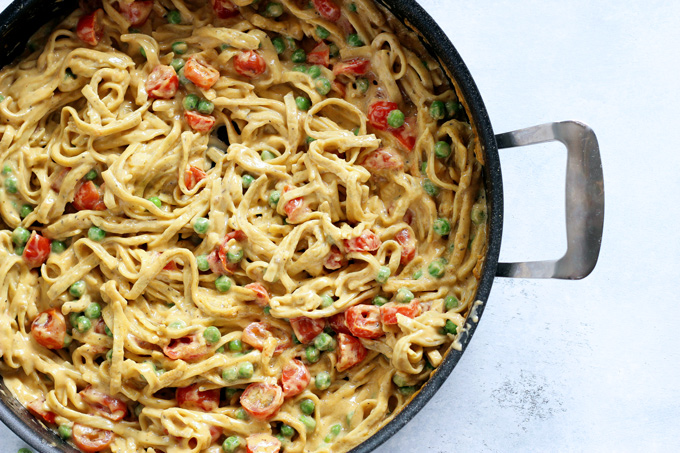 One Pot Vegan Fettuccine Alfredo with Peas and Roasted Cherry Tomatoes - Creamy healthy deliciousness all in one pot. NeuroticMommy.com #vegan #dinner #healthy