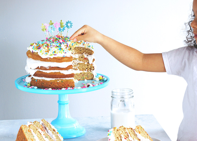 Unicorn Birthday Cake Celebrations - Celebrate with NeuroticMommy bringing in her birthday colorful, sparkly, and full of love! This vanilla dream unicorn cake is totally vegan and overloaded with coconut whipped cream! NeuroticMommy.com #birthdaycake #vegan #cake