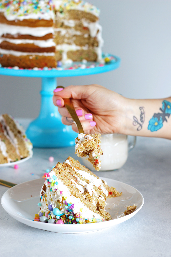 Unicorn Birthday Cake Celebrations - Celebrate with NeuroticMommy bringing in her birthday colorful, sparkly, and full of love! This vanilla dream unicorn cake is totally vegan and overloaded with coconut whipped cream! NeuroticMommy.com #birthdaycake #vegan #cake