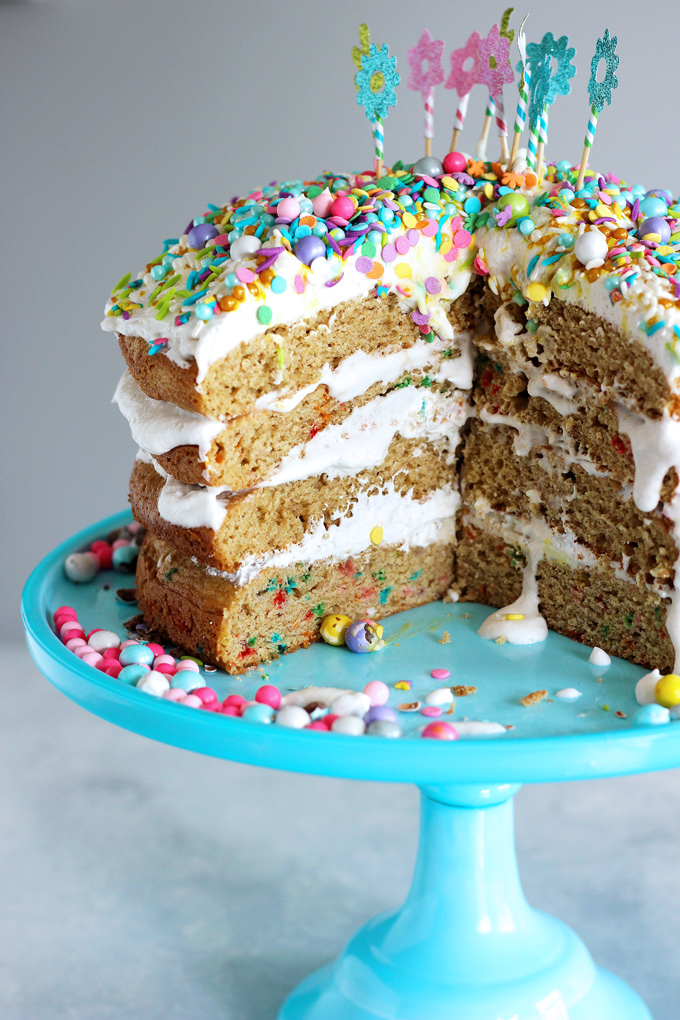 Unicorn Birthday Cake Celebrations - Celebrate with NeuroticMommy bringing in her birthday colorful, sparkly, and full of love! This vanilla dream unicorn cake is totally vegan and overloaded with coconut whipped cream! NeuroticMommy.com #birthdaycake #vegan #cake
