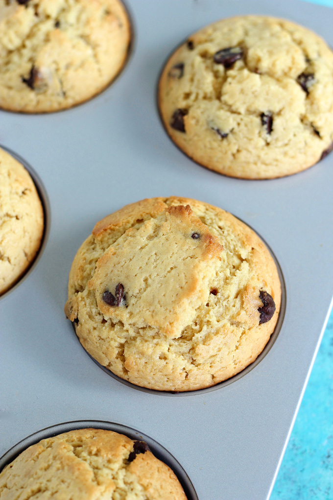 Jumbo Bakery Style Chocolate Chip Muffins - These vegan fluffy and moist muffins are perfect for breakfast, brunch or snack time. Each bite filled with melty chocolate chips! NeuroticMommy.com #vegan #muffins #snacks