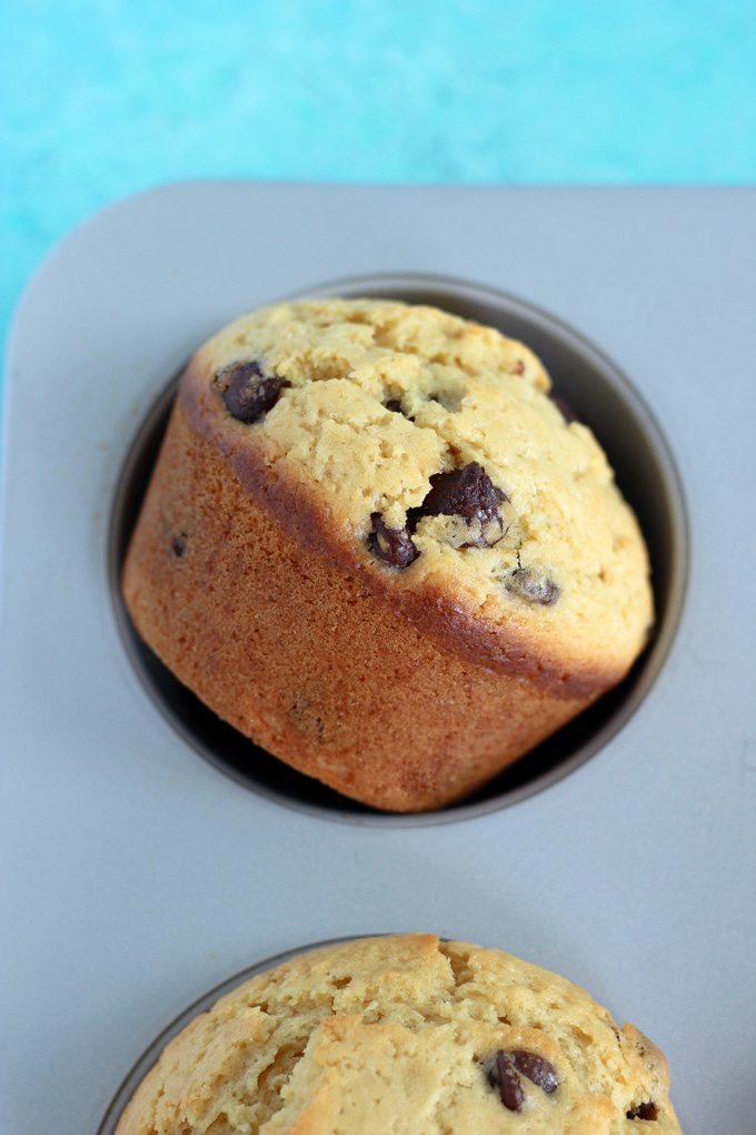 Jumbo Bakery Style Chocolate Chip Muffins - These vegan fluffy and moist muffins are perfect for breakfast, brunch or snack time. Each bite filled with melty chocolate chips! NeuroticMommy.com #vegan #muffins #snacks