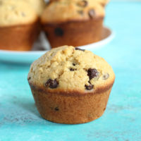 Jumbo Bakery Style Chocolate Chip Muffins - These vegan fluffy and moist muffins are perfect for breakfast, brunch or snack time. Each bite filled with melty chocolate chips! NeuroticMommy.com #vegan #muffins #snacks