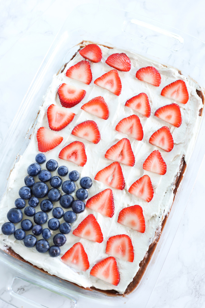 American Flag Chocolate Pudding Poke Cake - A festive fun way to decorate your cakes this summer. Made with all vegan ingredients and coconut whip cream, you cannot go wrong. NeuroticMommy.com #vegan #cake #chocolate