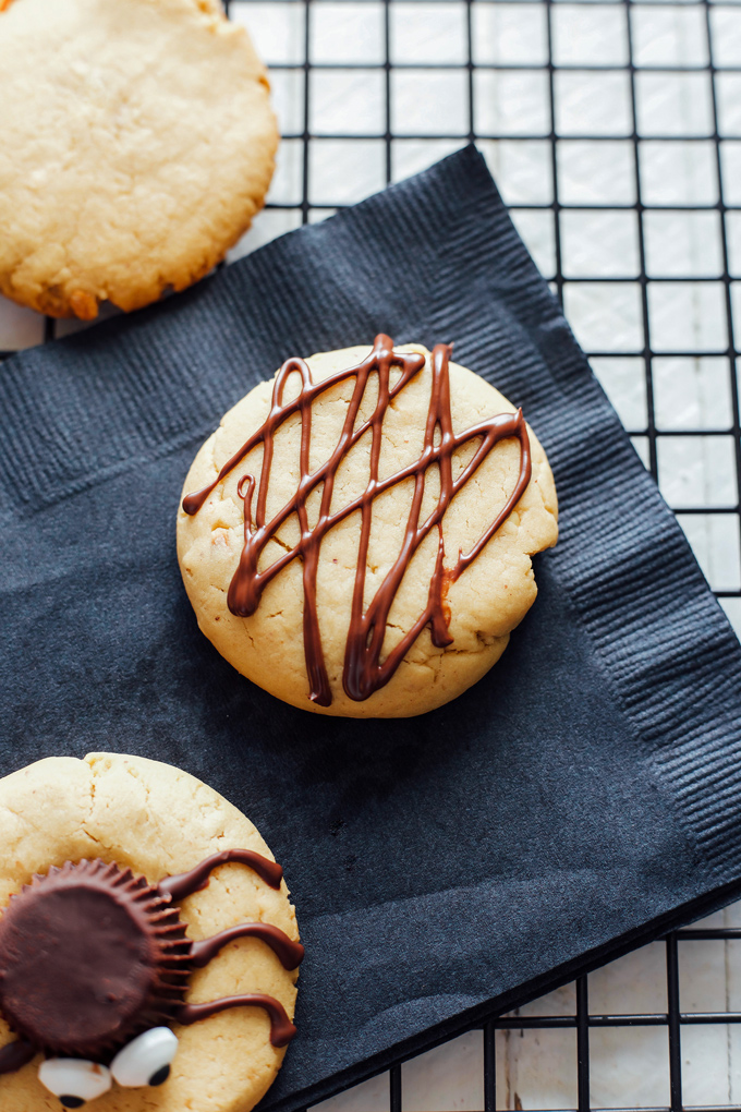 Spooky Spider Cookies - These vegan peanut butter gems are drizzled in sweet dark chocolate are chewy and full of deliciousness in every bite! The perfect tasty little snack for Halloween and super spooky! NeuroticMommy.com #vegancookies #halloween #vegansnacks