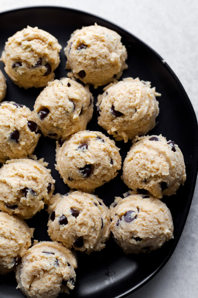 Vegan Cookie Dough Cheesecake Bites - If your a cookie dough and cheesecake lover then these are the bites for you! Made with sugar free dark chocolate chips, sweetened with monk fruit, making this low carb snack a must have. NeuroticMommy.com #vegan #fatbomb #keto #snacks