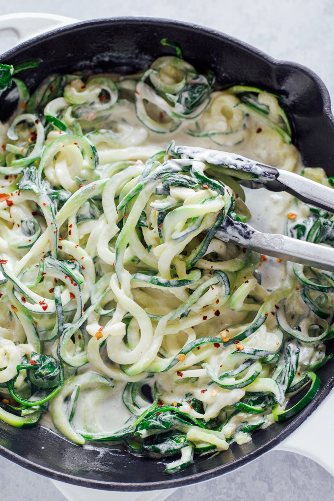 Zucchini Noodles in a Garlic Lemon Vegan Cream Sauce -This is a fresh and simple meal done and ready in less than 20 minutes. You can whip this up any day of the week keeping it comforting with a healthy twist. NeuroticMommy.com #vegan #dairyfree #glutenfree