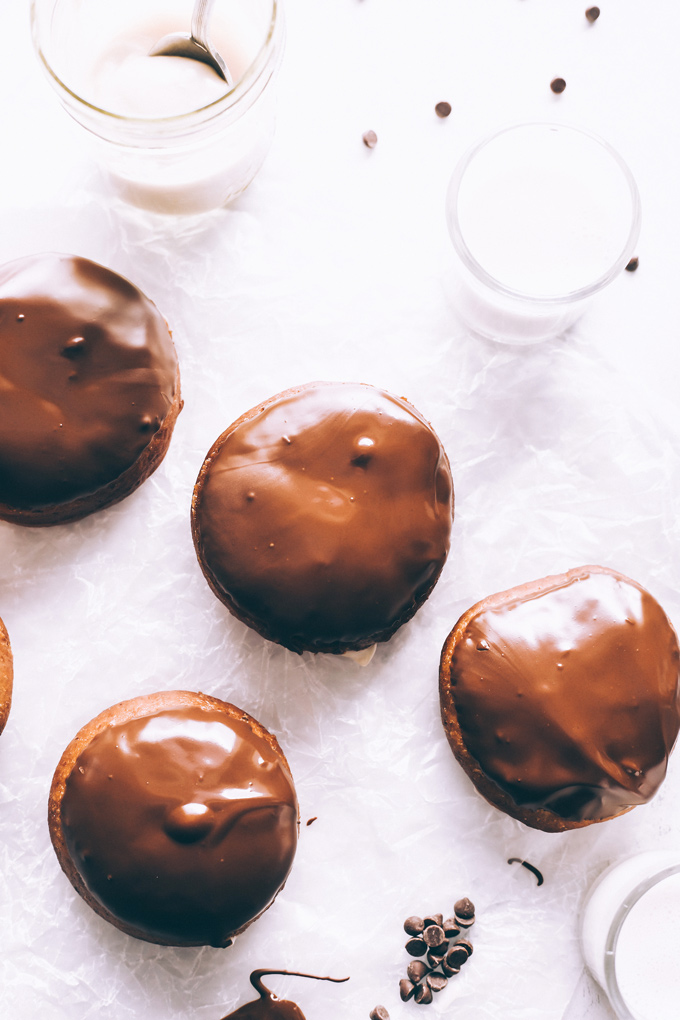 Vegan Boston Cream Doughnuts - These are generously filled with creamy vanilla custard and coated in a thick layer of dairy free chocolate making them a snack must have! NeuroticMommy.com #vegan #bostoncream