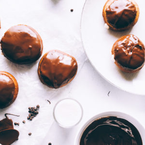 Vegan Boston Cream Doughnuts - These are generously filled with creamy vanilla custard and coated in a thick layer of dairy free chocolate making them a snack must have! NeuroticMommy.com #vegan #bostoncream