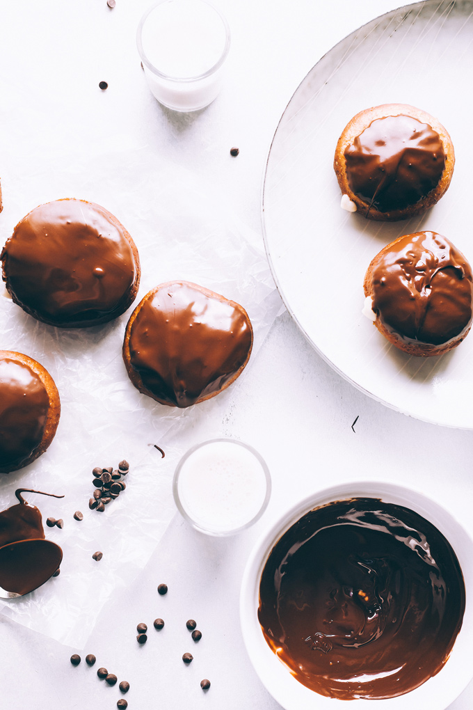 Vegan Boston Cream Doughnuts - These are generously filled with creamy vanilla custard and coated in a thick layer of dairy free chocolate making them a snack must have! NeuroticMommy.com #vegan #bostoncream