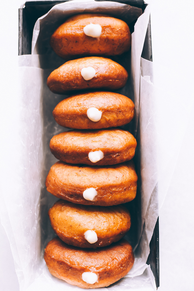 Vegan Boston Cream Doughnuts - These are generously filled with creamy vanilla custard and coated in a thick layer of dairy free chocolate making them a snack must have! NeuroticMommy.com #vegan #bostoncream