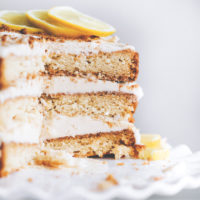 This spectacular Vegan Lemon Cream Layer Cake is a delectable cake for the most special of occasions. Enjoy the creamy lemon buttercream sandwiched between layers of homemade vanilla cake. NeuroticMommy.com #vegan #cake #easter