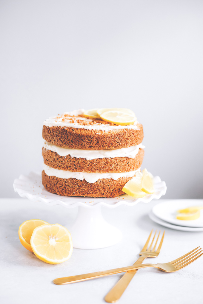 This spectacular Vegan Lemon Cream Layer Cake is a delectable cake for the most special of occasions. Enjoy the creamy lemon buttercream sandwiched between layers of homemade vanilla cake. NeuroticMommy.com #vegan #cake #easter