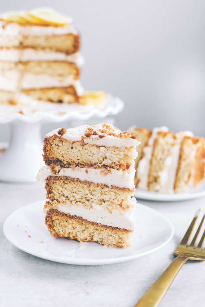 This spectacular Vegan Lemon Cream Layer Cake is a delectable cake for the most special of occasions. Enjoy the creamy lemon buttercream sandwiched between layers of homemade vanilla cake. NeuroticMommy.com #vegan #cake #easter